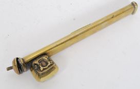 A middle eastern brass scholars pencil case of simple form with typical decorations.