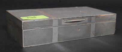 A silver hallmarked cigarette box retailed by Kemp Brothers Bristol,