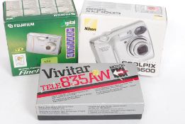 A NIkon Coolpix 5600 digital camera in box together with a Fukifilm digital finepix a203 camera and