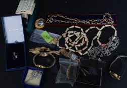 A collection of mainly costume jewellery to include silver brooches,