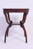 An Edwardian mahogany clover leaf side - lamp  table etagere, with shaped legs,