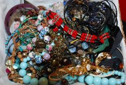 A box of assorted costume jewellery to include bracelets, necklaces etc.