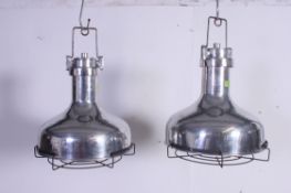 A pair of vintage industrial style reproduction aluminium / brushed steel pendant light based on