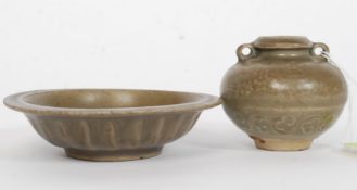 A Celadon dish, having a pair of fish raised in relief, made in the northern province Honan,