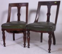 2 Victorian mahogany aesthetic movement dining chairs in faux green leather with turned legs.