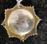 A gilded silver hallmarked and enamel masonic lodge badge with notation to verso for Brother Hugh B.