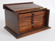 An excellent early 20th century Mah Jong set in oak case with drawers complete with porcelain