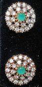 A pair of white metal and silver cz and emerald set earrings