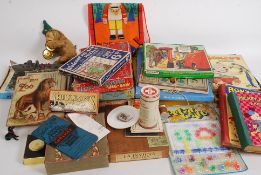 A box of Edwardian and later toys and games to include Victory jigsaw puzzles, other puzzles,