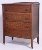 A 1930's utility style oak chest of drawers.