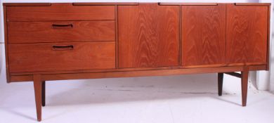 An excellent Danish style 1970's teak wood sideboard raised on tapered legs with a series of
