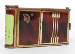 A 1930's Art Deco ladies musical - manicure combination compact having faux tortoiseshell and
