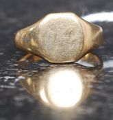 A 9ct gold hallmarked vintage gentlemans signet ring with plain front. Stamped to shank.