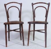 A pair of 1920's bentwood Thonet style bentwood Cafe / Bistro chairs. Measures: 92 x 38 x 38.
