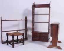 A collection of furniture to include wall hanging shelves, a foot stool,