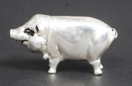 A silver plated vesta case in the form of a pig. Standing on all fours, with hinged head.