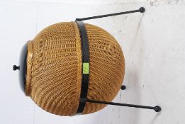 A Lloyd Loom Sputnik wicker linen basket, designed by Geoffrey Lusty,