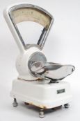A set of 1950's white vintage enamelled grocers industrial scale with upright chrome dial H55cm