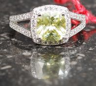 A silver white metal cz and citrine style centre stone ring.