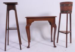 A Queen Anne style oak lowboy table raised on cabriole legs together with a barrel planter and a