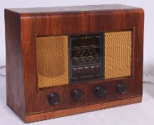 A vintage wooden cased valve radio Type AC 11 by Bush,