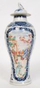 A Chinese 19th century Blue & White tall famille rose vase having blue ground with detailed panels