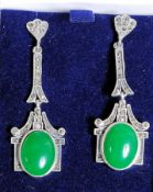 A pair of silver ( 925 ) and marcasite earrings, decorated with jade.