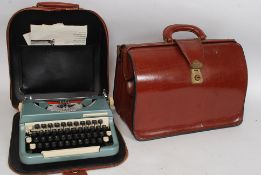 A vintage leather briefcase along with a cased portable Imperial typewriter