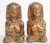 A good heavy pair of copper filled Egyptian figures / paperweights in the form of a Sphinx  H10cm