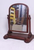 A late 19th century / early 20th century Victorian mahogany swivel dressing table mirror on carved