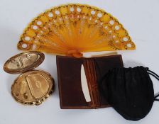 An unusual German Empire Coat of Arms (1889) leather wallet with embossed  centre together with a