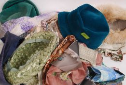 A collection of vintage ladies clothing to include hats from the mid 20th century,