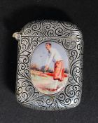 A  rococo chased silver white metal vesta case bearing an enamel style plaque of a batsman -