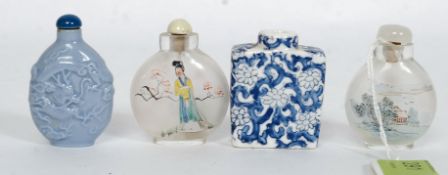 A collection of Chinese snuff bottles to include a ceramic blue and white example,