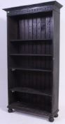 A large solid oak 20th century jacobean revival 6ft open window bookcase cabinet having carved