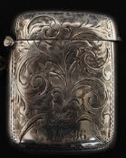 A silver hallmarked vesta having rococo chased and etched design with striker to base.