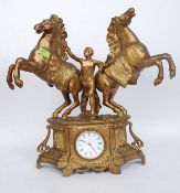 An antique French made gilt painted spelter topped mantel clock.