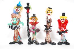 A group of 4 Murano coloured / studio glass clowns to include clown by a lamp post ,