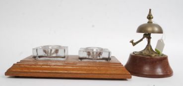 A fabulous Art Nouveau hotel reception brass attention bell with handle set on wooden socle