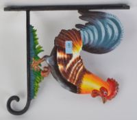 A large 20th century hand painted cast metal hanger in the form of a cockerel