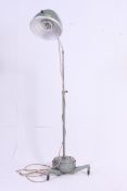 A vintage 1950's Hanovia dentists lamp on trolley with anglepoise stem having large enamel painted
