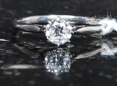 An 18ct white gold and diamond single stone claw set solitaire ring with wonderful inset stone