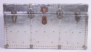 A large polished Aluminium steamer trunk,