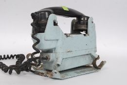 A vintage 20th century Industrial - believed military submarine telephone having central ring dial