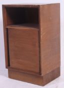 A  retro 20th century Stag  C range bedside cabinet in walnut with ebonised detailing.