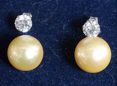 A pair of white metal silver and freshwater pearl earrings