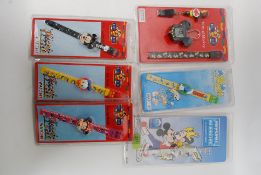 A collection of unopened Disney character  watches  to include Mickey Mouse, Minnie Mouse,