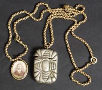 A 19th century silver plated / white metal vesta with striker together with a half locket on chain