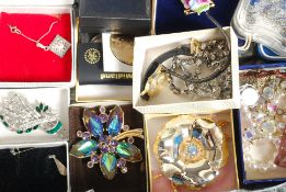 A collection of costume jewellery to include silver earrings, brooches, watch,