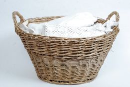 A large lot of assorted antique household linens to include lace bedstead, cloths,